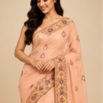 Peach Embroidered Saree with Multicolour Mirror Work Border & Tassels
